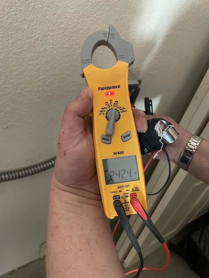 Voltage testing with clamp meter during Whole House Surge Protector in Millbrook